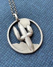Load image into Gallery viewer, Handcrafted sterling silver saguaro pendant necklace from Towed Studio in Tucson, Arizona. Exquisite detailing of a saguaro cactus, ideal for nature enthusiasts and individuals seeking a distinct desert-themed accessory. Sustainable, hypoallergenic, and available at TowedStudio.com. Explore the collection now