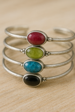 Load image into Gallery viewer, Close-up of gemstone setting and silver raindrop embellishments on handcrafted cuff bracelet with TowedStudio.com
