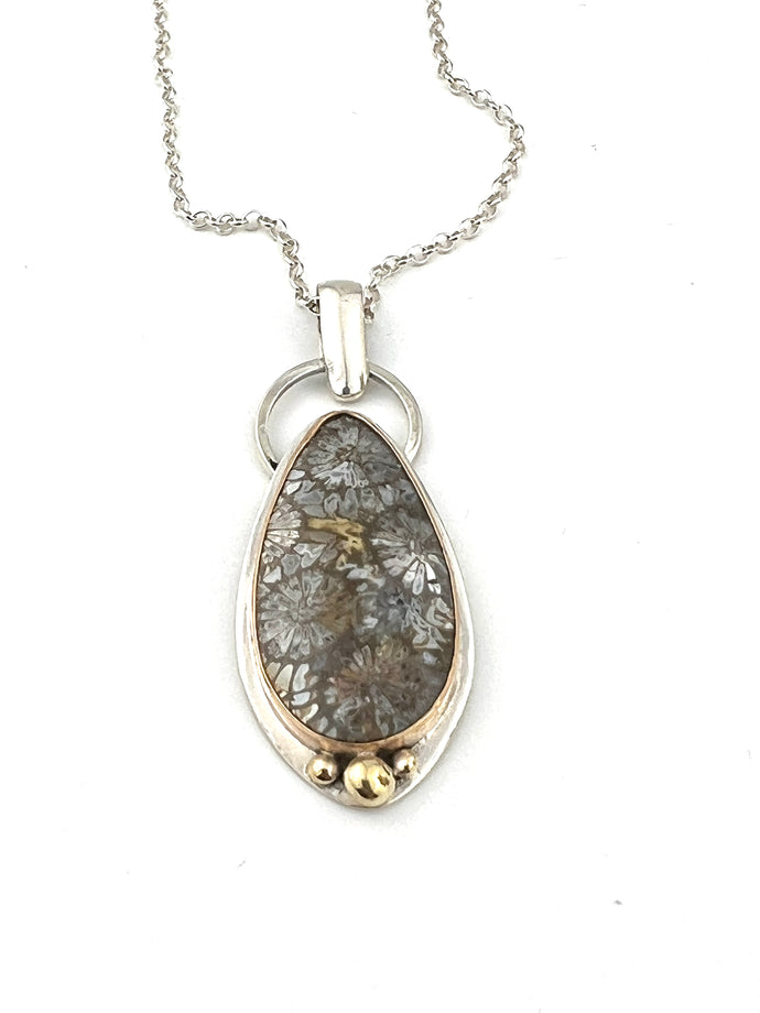 Indonesian Fossil Coral in sterling silver with a 14k gold filled bezel and accents.  